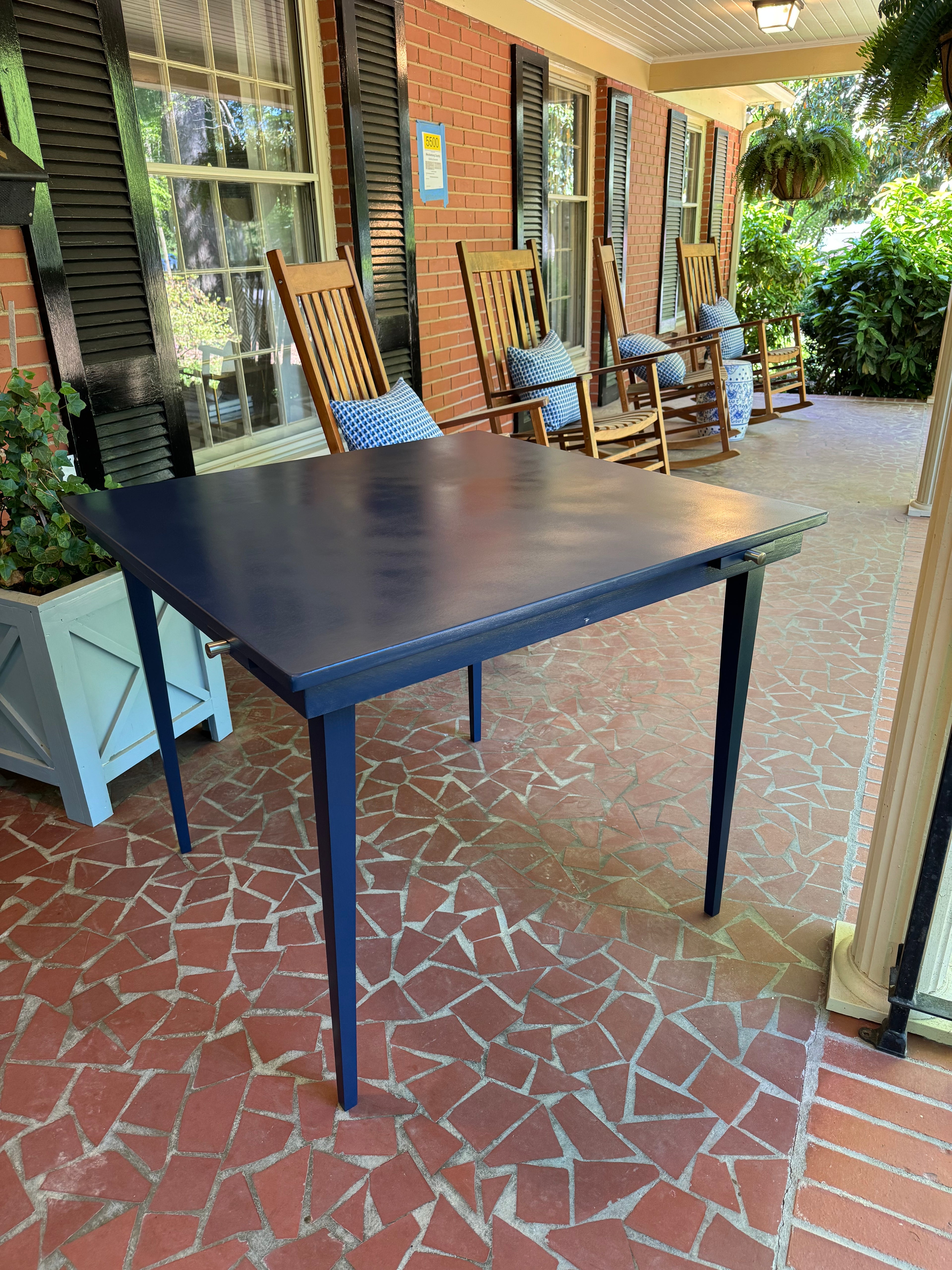 The Skiff Game Table – lightweight portable mahjong table with tapered legs and pull-out drink holders, custom painted