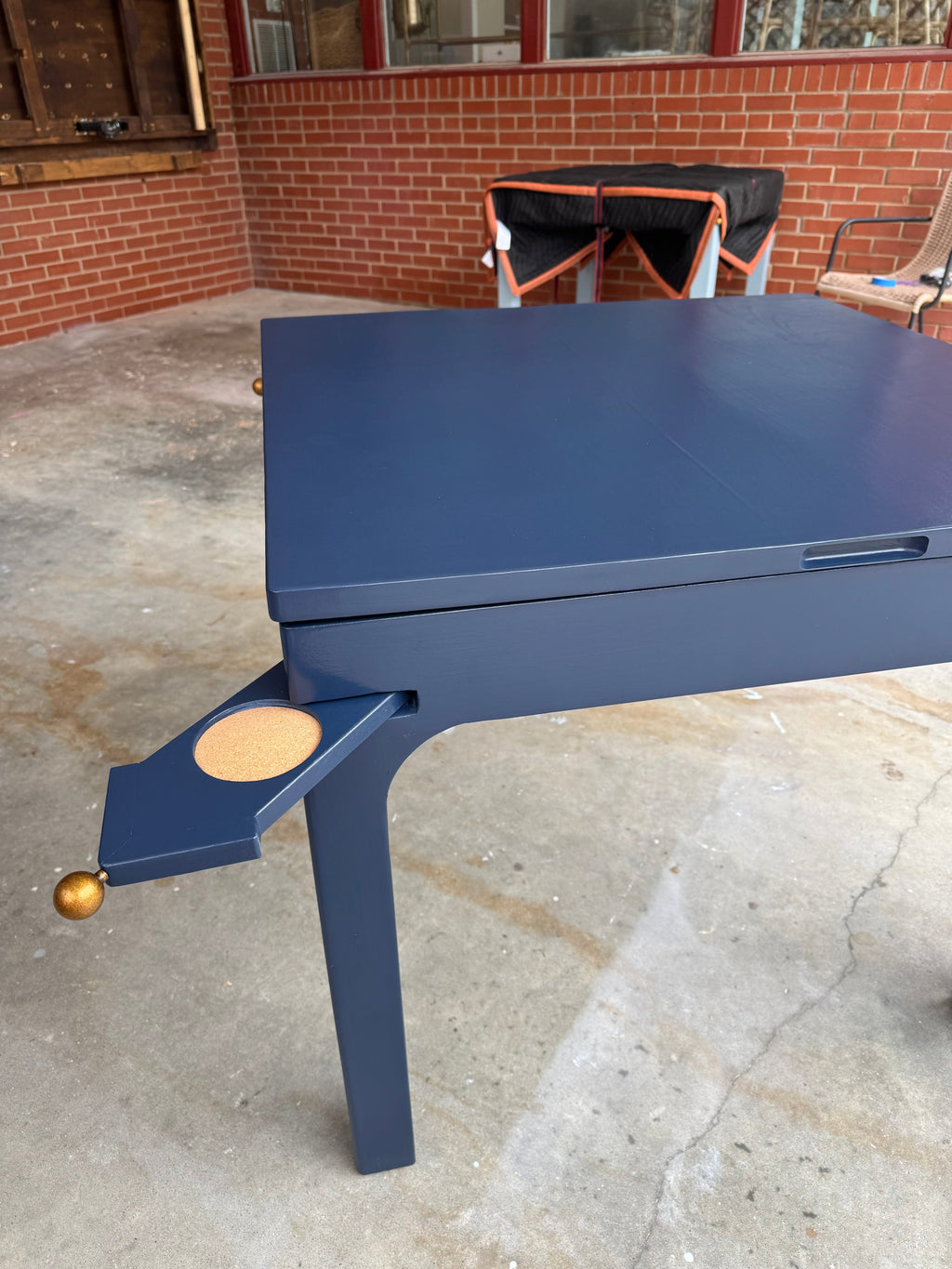 Drift Game Table lift-top detail showing storage well beneath playing surface